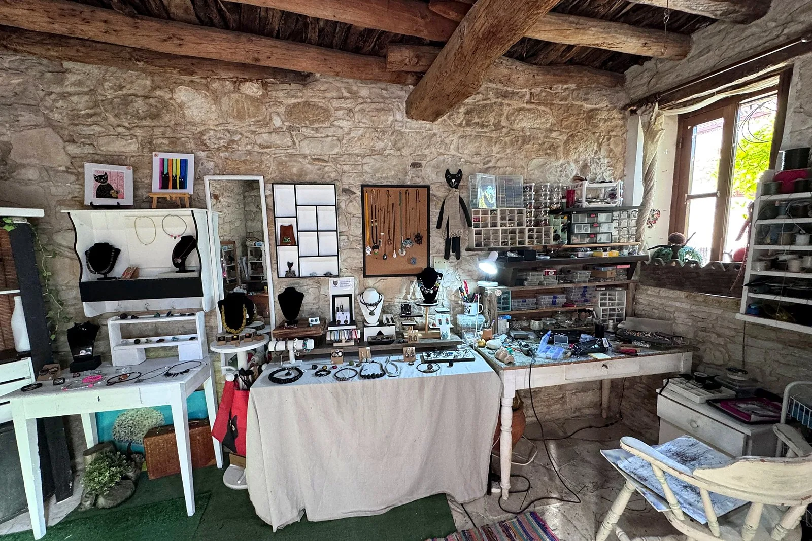 Lania village, Cyprus: we walked into every open door Wide view of a jewellery studio with wooden ceiling beams and display tables in Lania, Cyprus