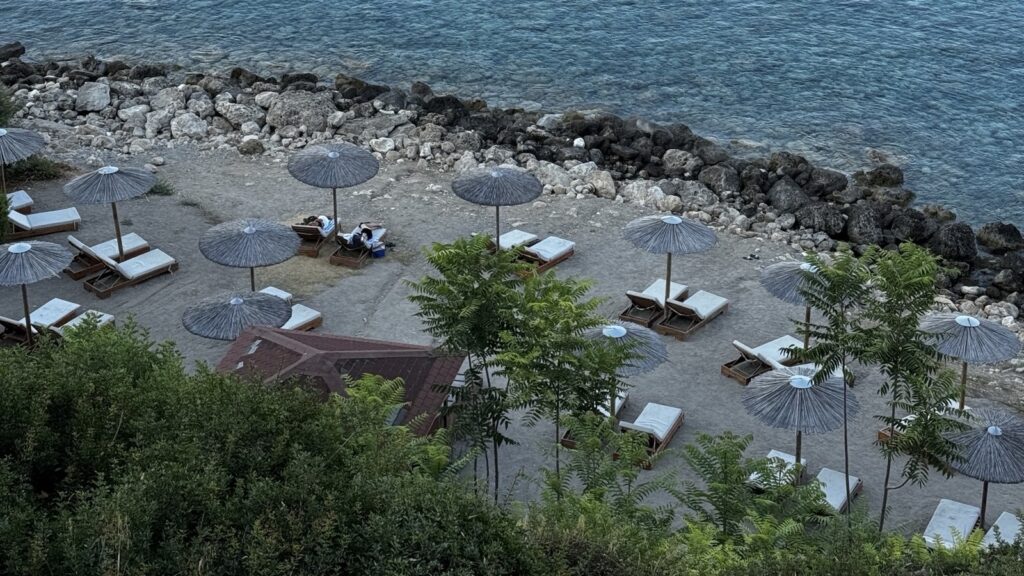 Where to stay near the Baths of Aphrodite: a quiet Akamas camp with two coves of its own Quiet beach with straw umbrellas at Aphrodite Family Eco Camping, Akamas, Cyprus