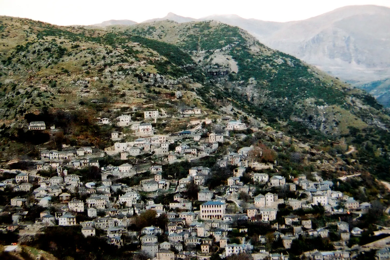 Stone houses of Syrrako climbing a steep mountain slope in the Tzoumerka range, Epirus