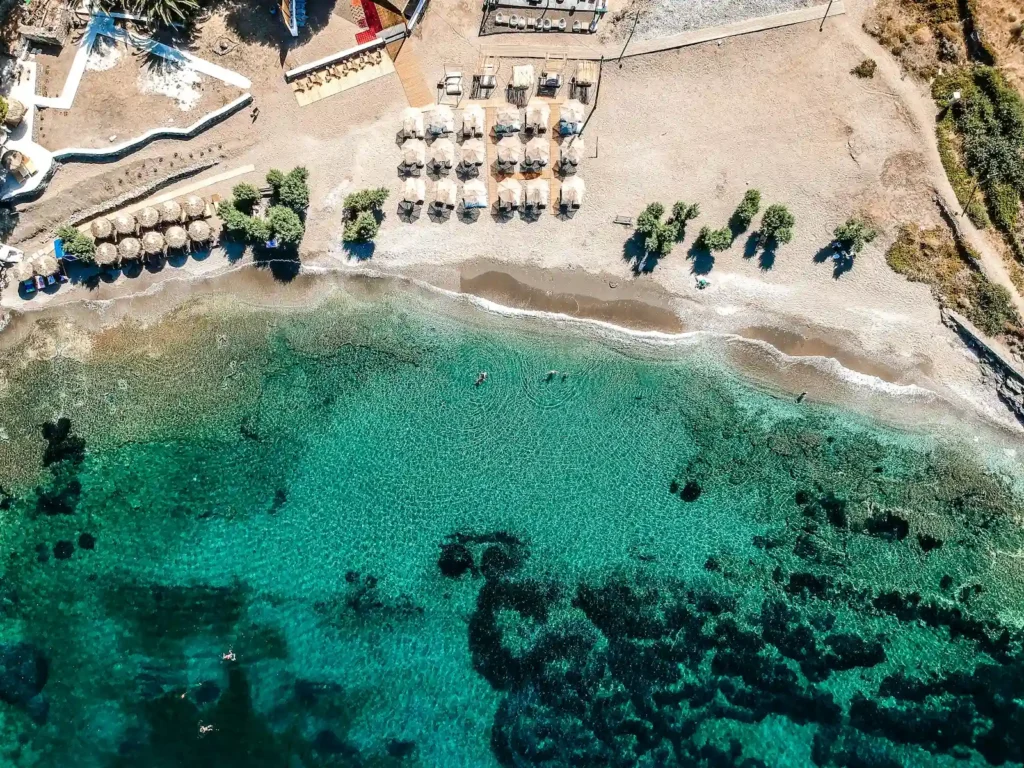 Kythnos: Where to Base Yourself and How to Get Around Aerial view of a clear turquoise bay and beach on Kythnos